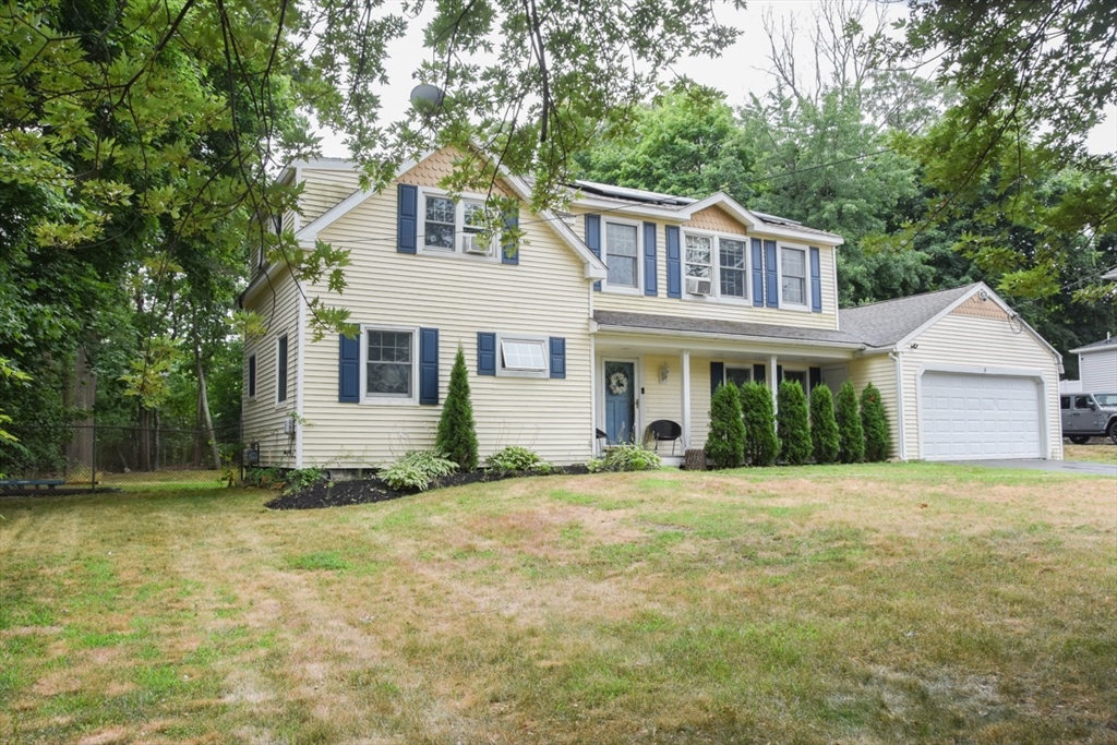 9 Topping Road Andover, MA 01810 - Photo 3 of 41 a front view of a house with a yard
