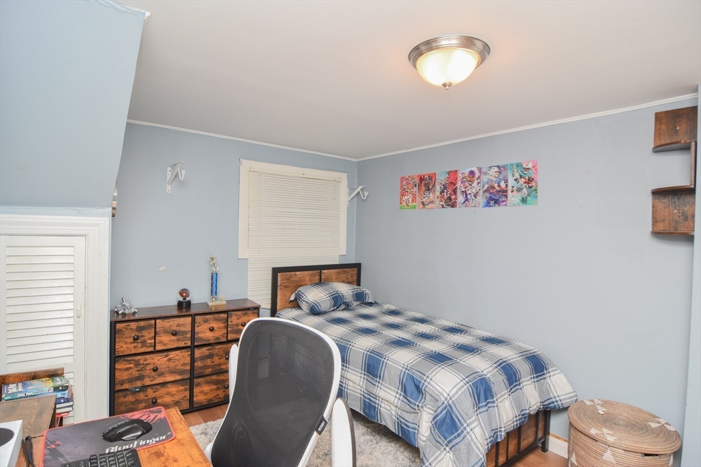 9 Topping Road Andover, MA 01810 - Photo 31 of 41 a bedroom with a bed and a window