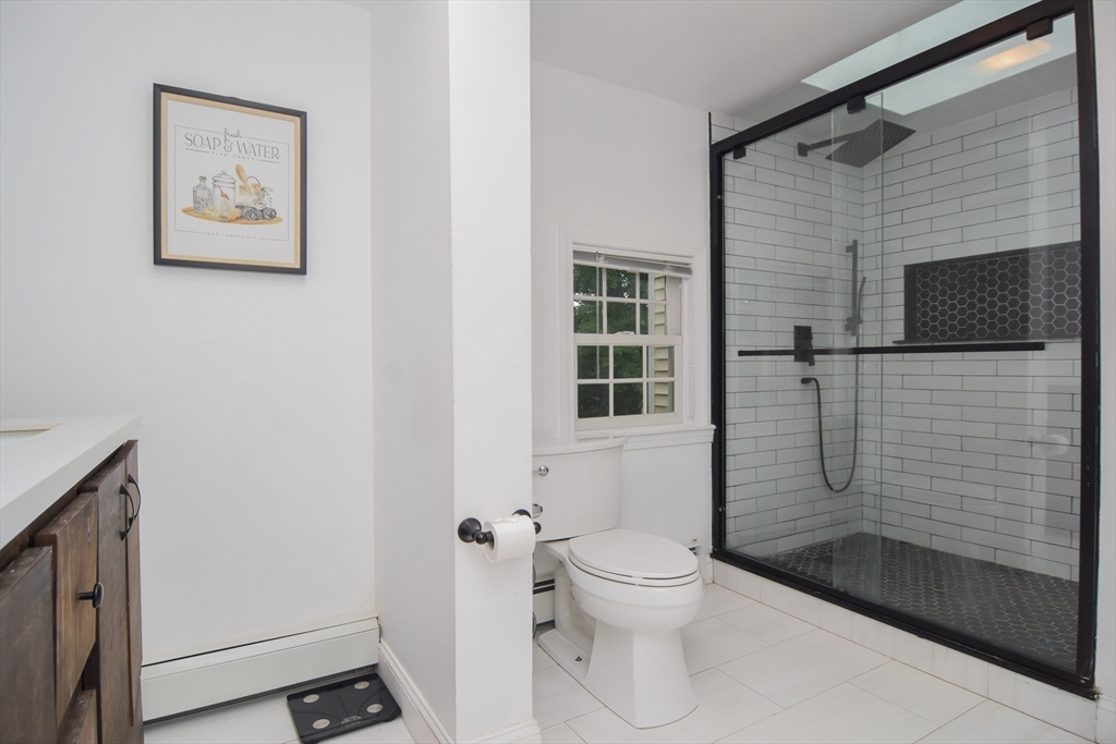 9 Topping Road Andover, MA 01810 - Photo 33 of 41 a bathroom with a toilet and shower