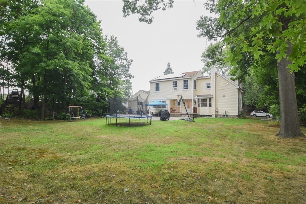 9 Topping Road Andover, MA 01810 - Photo 37 of 41 a view of a house with backyard and garden