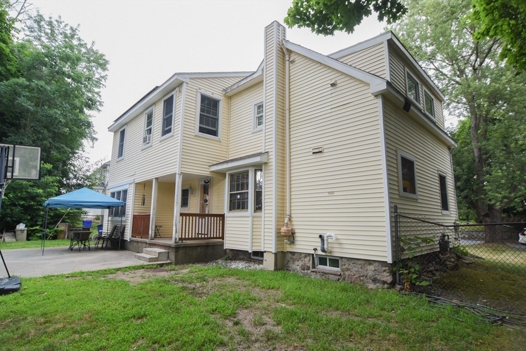 9 Topping Road Andover, MA 01810 - Photo 38 of 41 a front view of a house with a garden