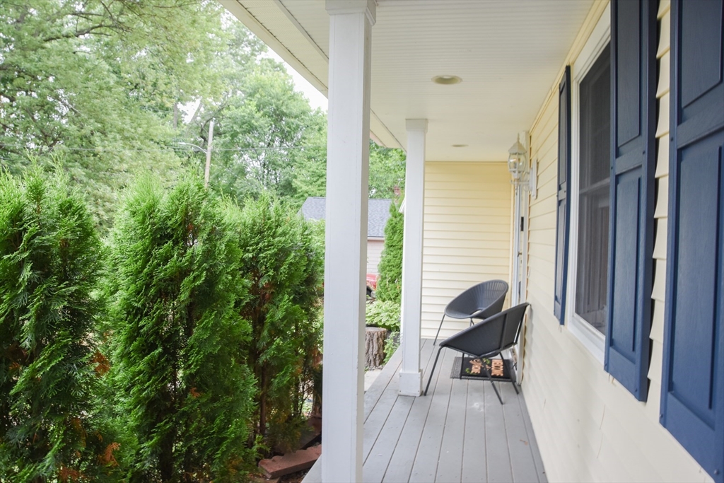 9 Topping Road Andover, MA 01810 - Photo 6 of 41 a balcony with chairs and with a potted plant
