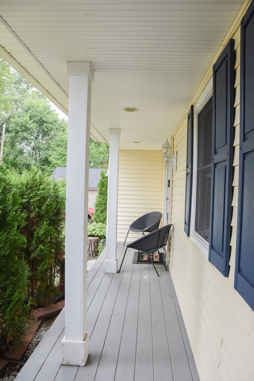 9 Topping Road Andover, MA 01810 - Photo 7 of 41 a view of balcony with furniture and wooden floor