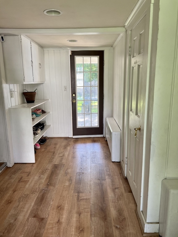 9 Topping Road Andover, MA 01810 - Photo 10 of 41 a view of a kitchen with wooden floor and electronic appliances