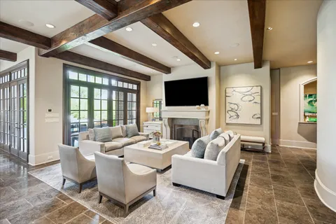 a living room with fireplace furniture and a flat screen tv