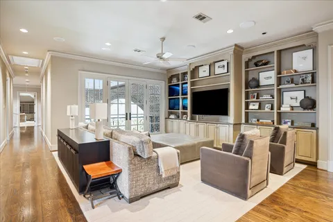 a living room with furniture fireplace and a flat screen tv