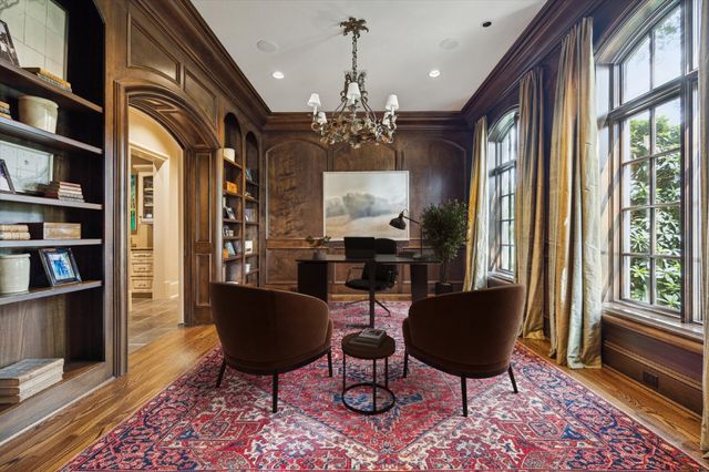 a view of a livingroom with furniture window and wooden floor