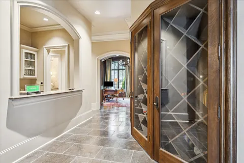a view of entryway and hall with dining room