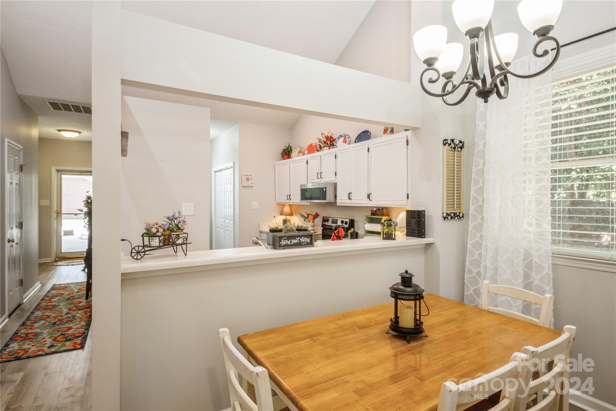 19960 Oak Leaf Circle Cornelius, NC 28031 - Photo 15 of 35 a kitchen with a table and chairs in it
