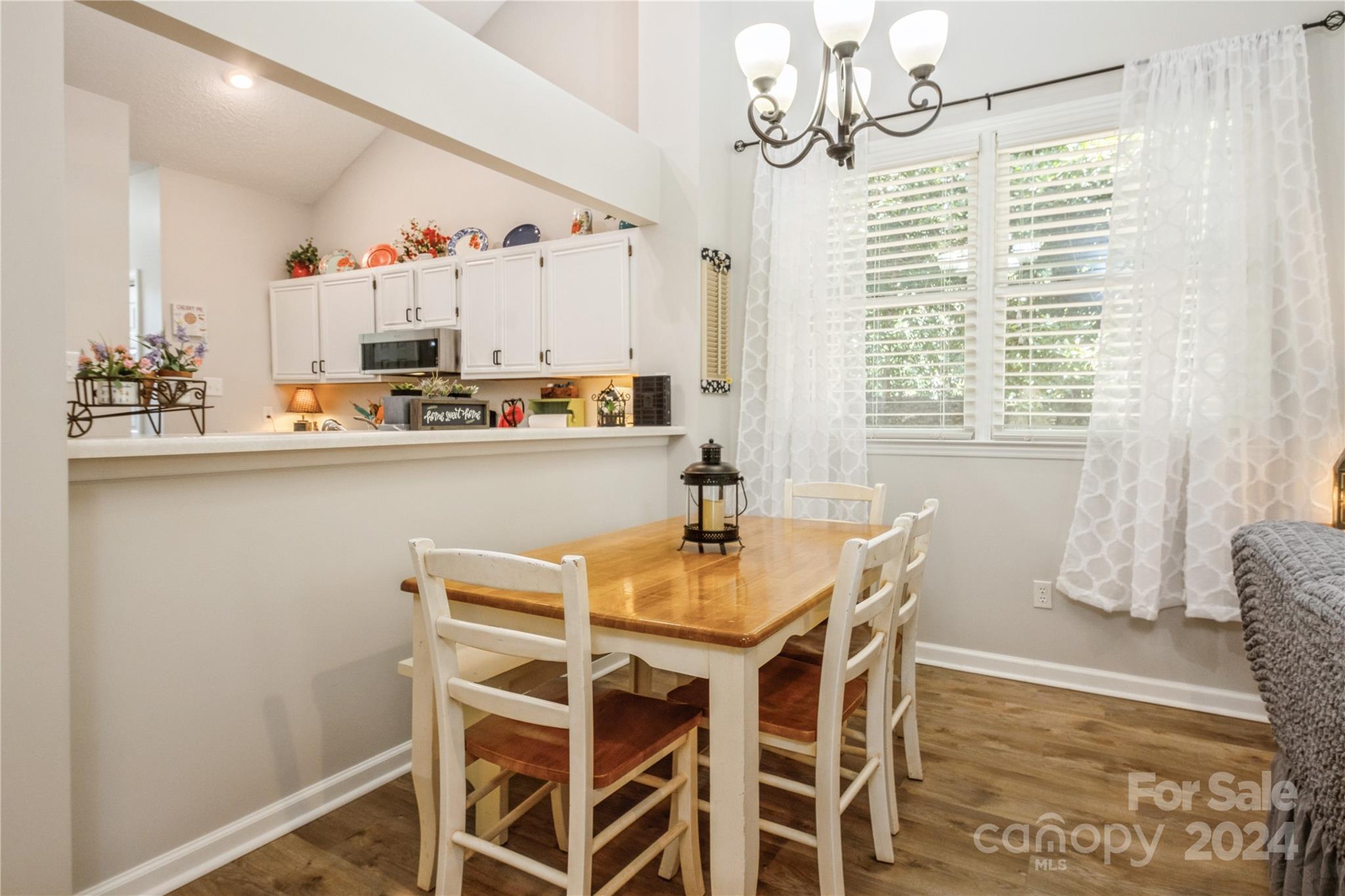 19960 Oak Leaf Circle Cornelius, NC 28031 - Photo 17 of 35 a dining room with furniture and window