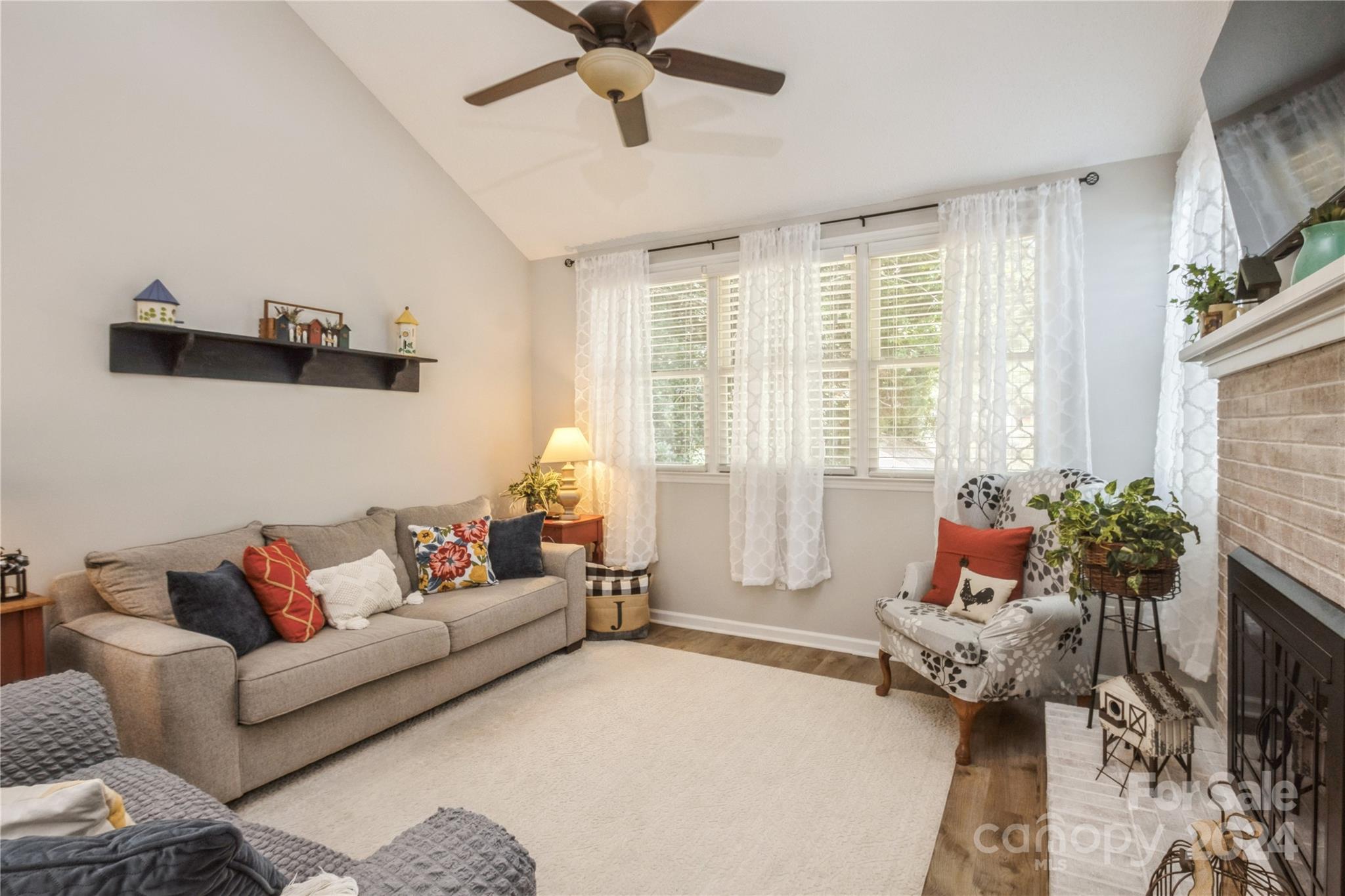 19960 Oak Leaf Circle Cornelius, NC 28031 - Photo 20 of 35 a living room with furniture and a large window