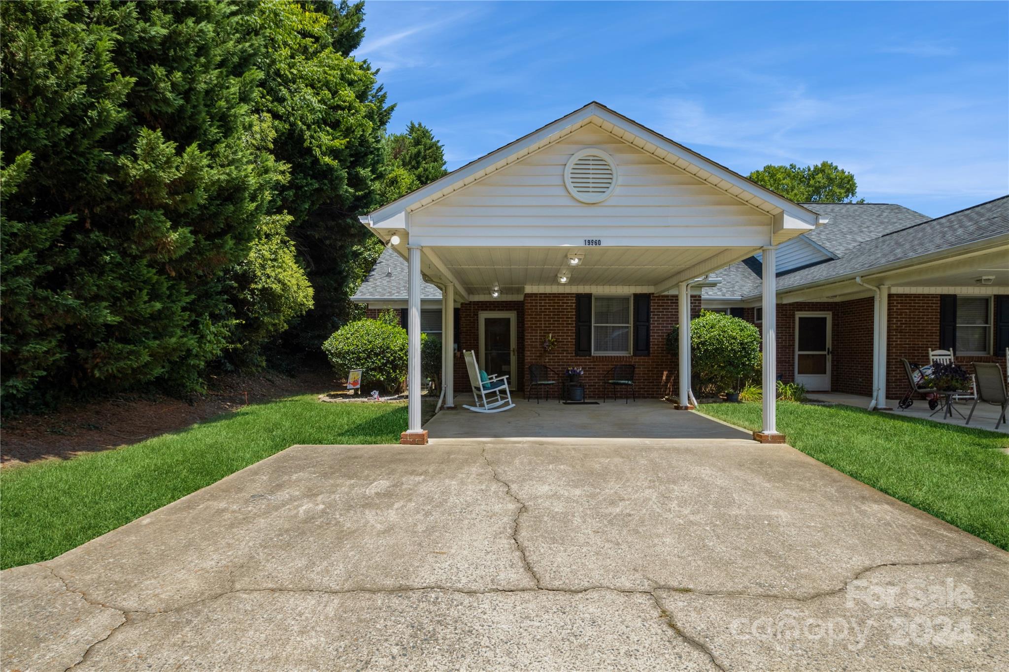19960 Oak Leaf Circle Cornelius, NC 28031 - Photo 2 of 35 front view of a house with a yard