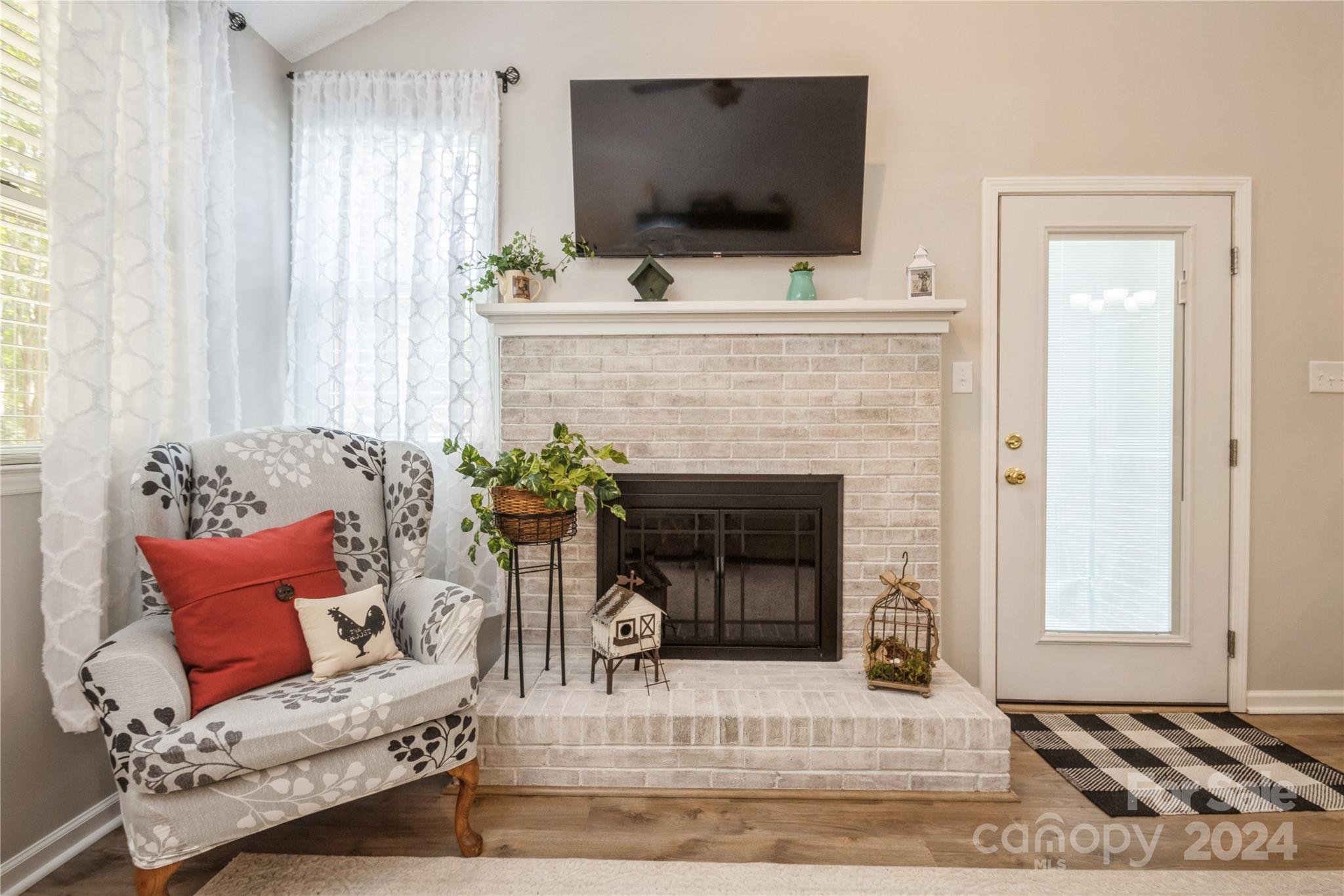 19960 Oak Leaf Circle Cornelius, NC 28031 - Photo 21 of 35 a living room with furniture and a fireplace