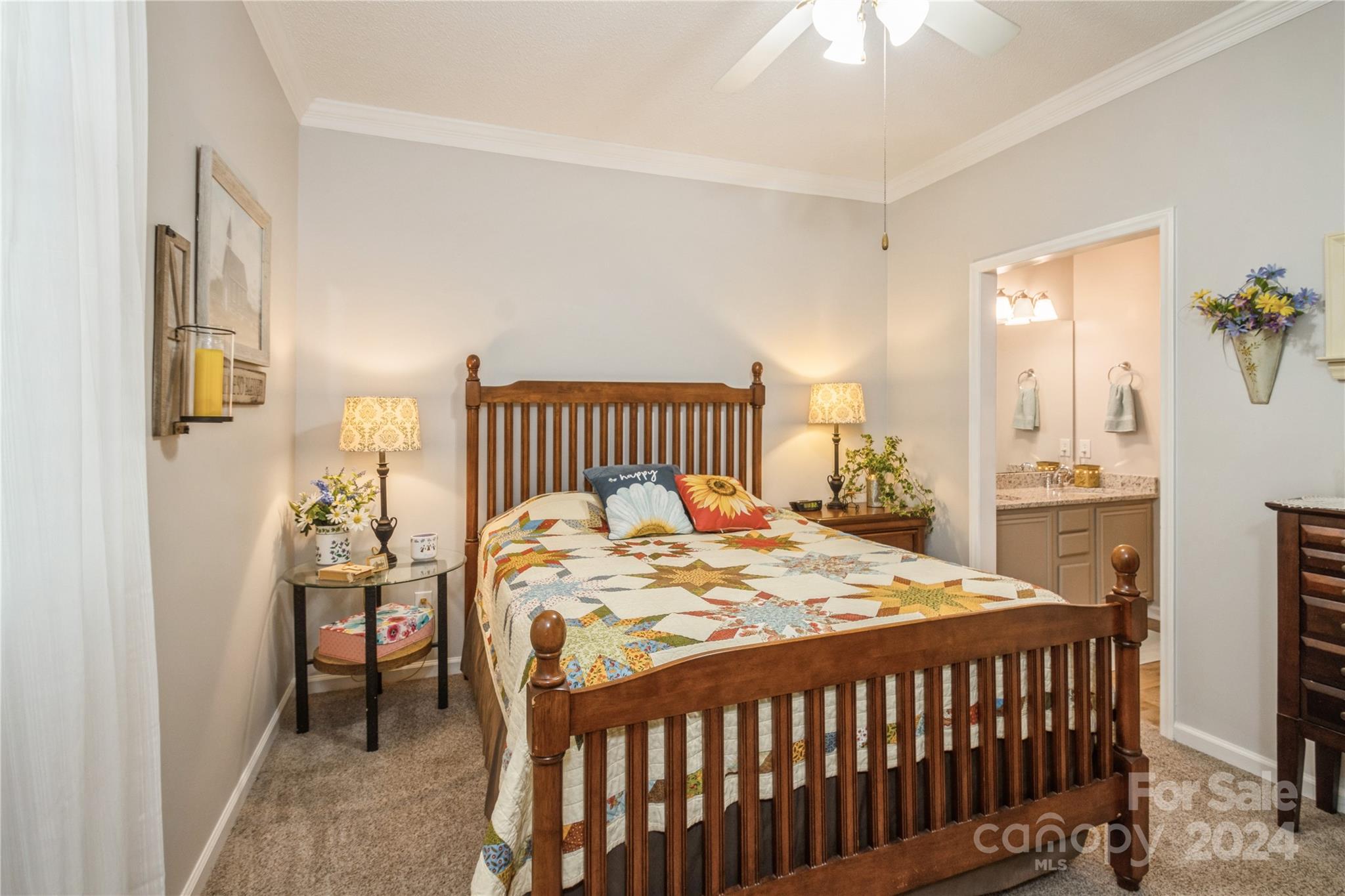19960 Oak Leaf Circle Cornelius, NC 28031 - Photo 23 of 35 a bedroom with a bed and a chandelier