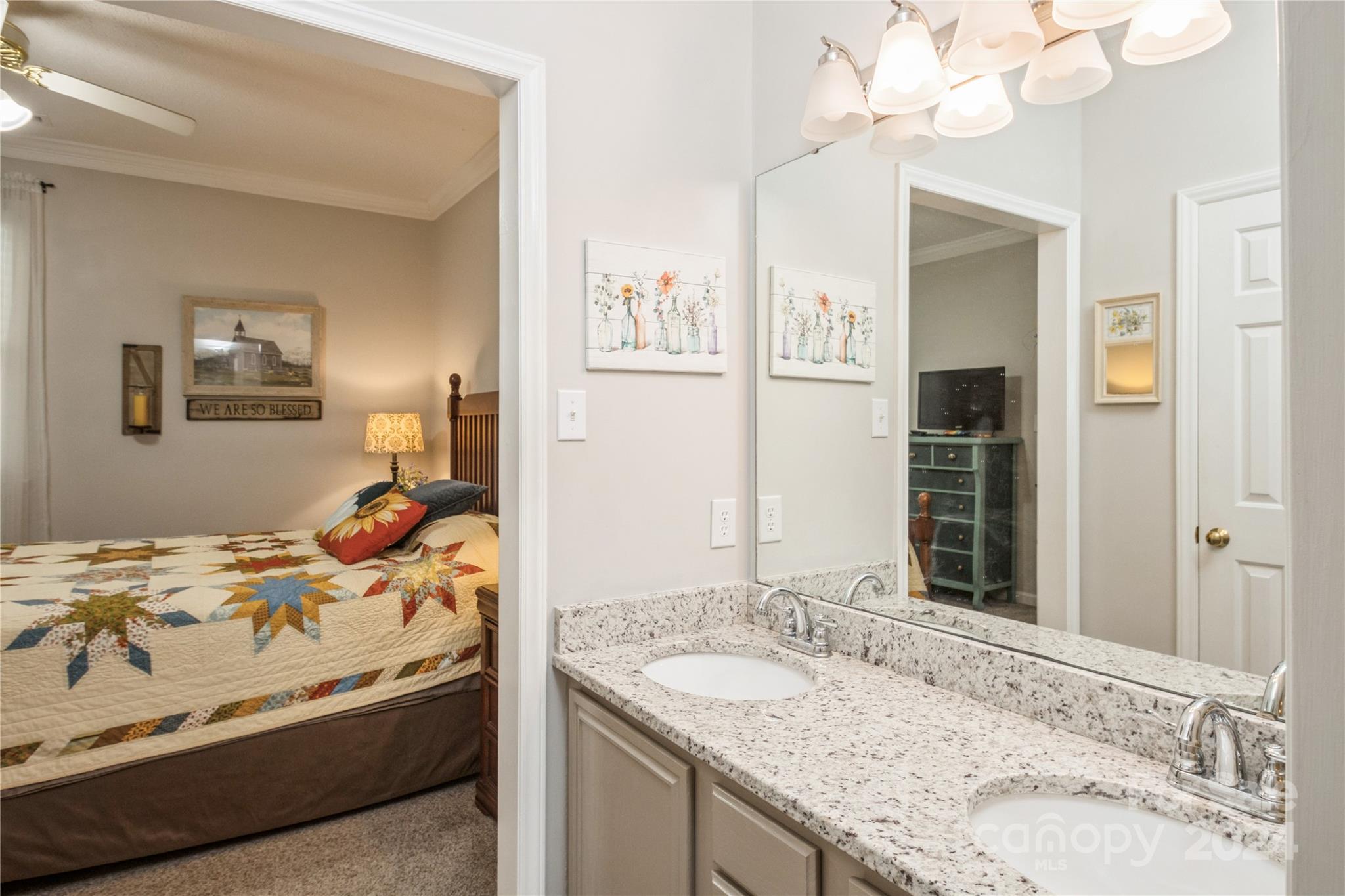 19960 Oak Leaf Circle Cornelius, NC 28031 - Photo 26 of 35 a en suite bathroom with a granite countertop sink and a mirror