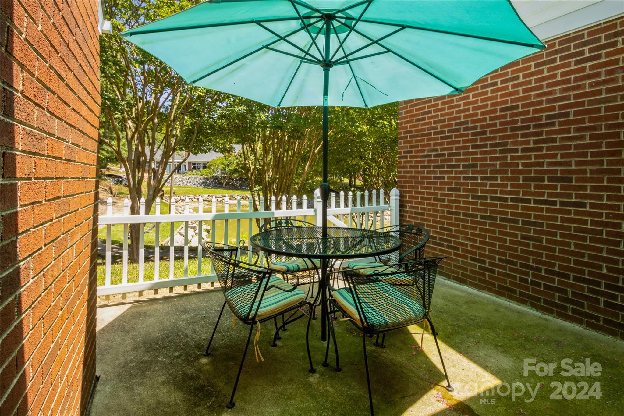 19960 Oak Leaf Circle Cornelius, NC 28031 - Photo 28 of 35 a table and chairs in the garden