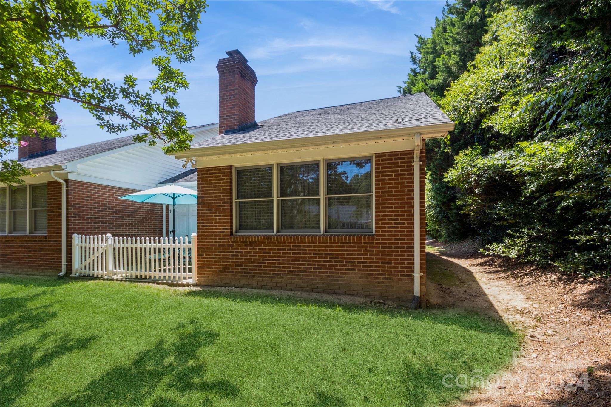19960 Oak Leaf Circle Cornelius, NC 28031 - Photo 30 of 35 a front view of a house with a garden