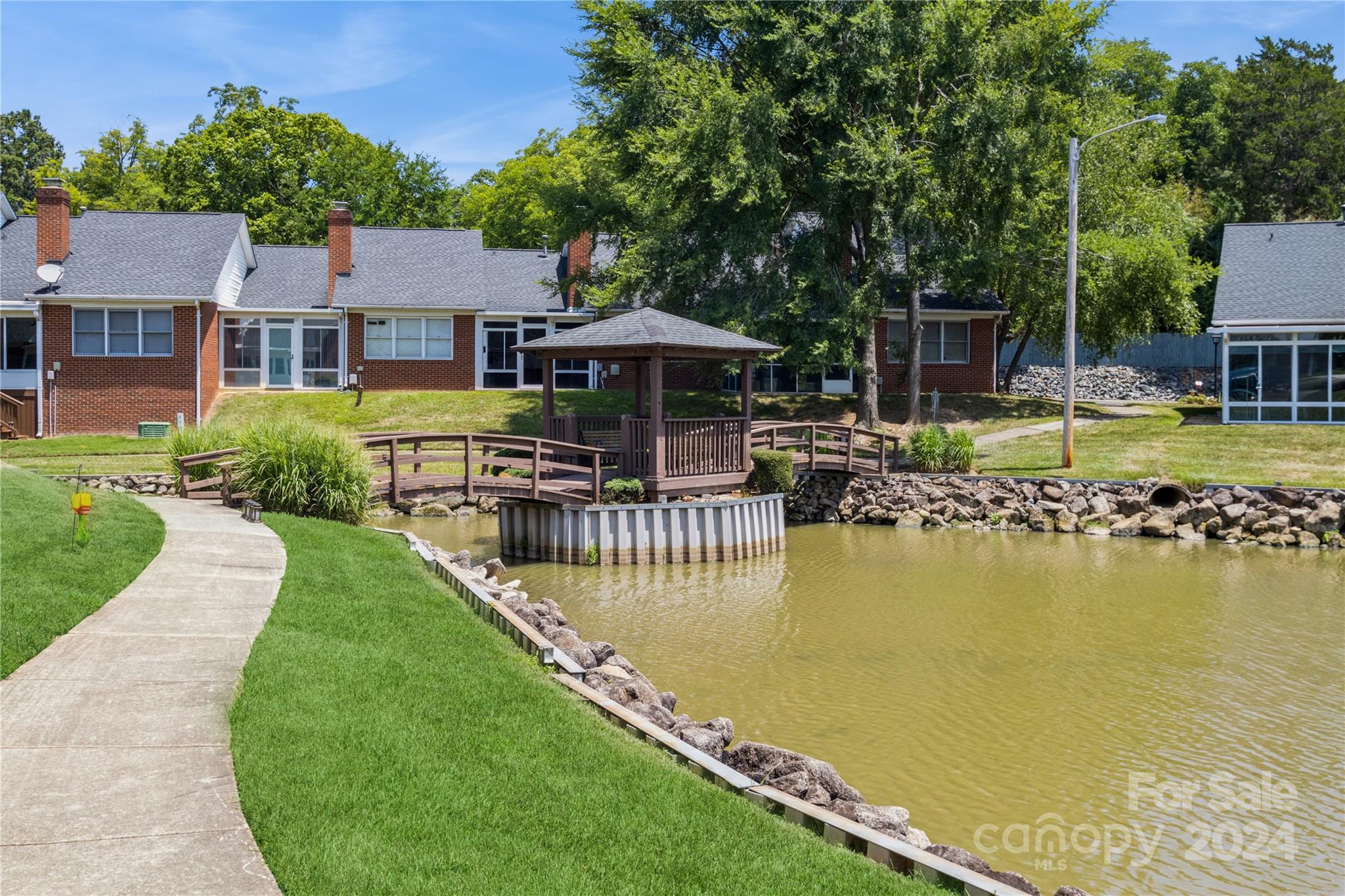19960 Oak Leaf Circle Cornelius, NC 28031 - Photo 31 of 35 a front view of house with yard and lake view