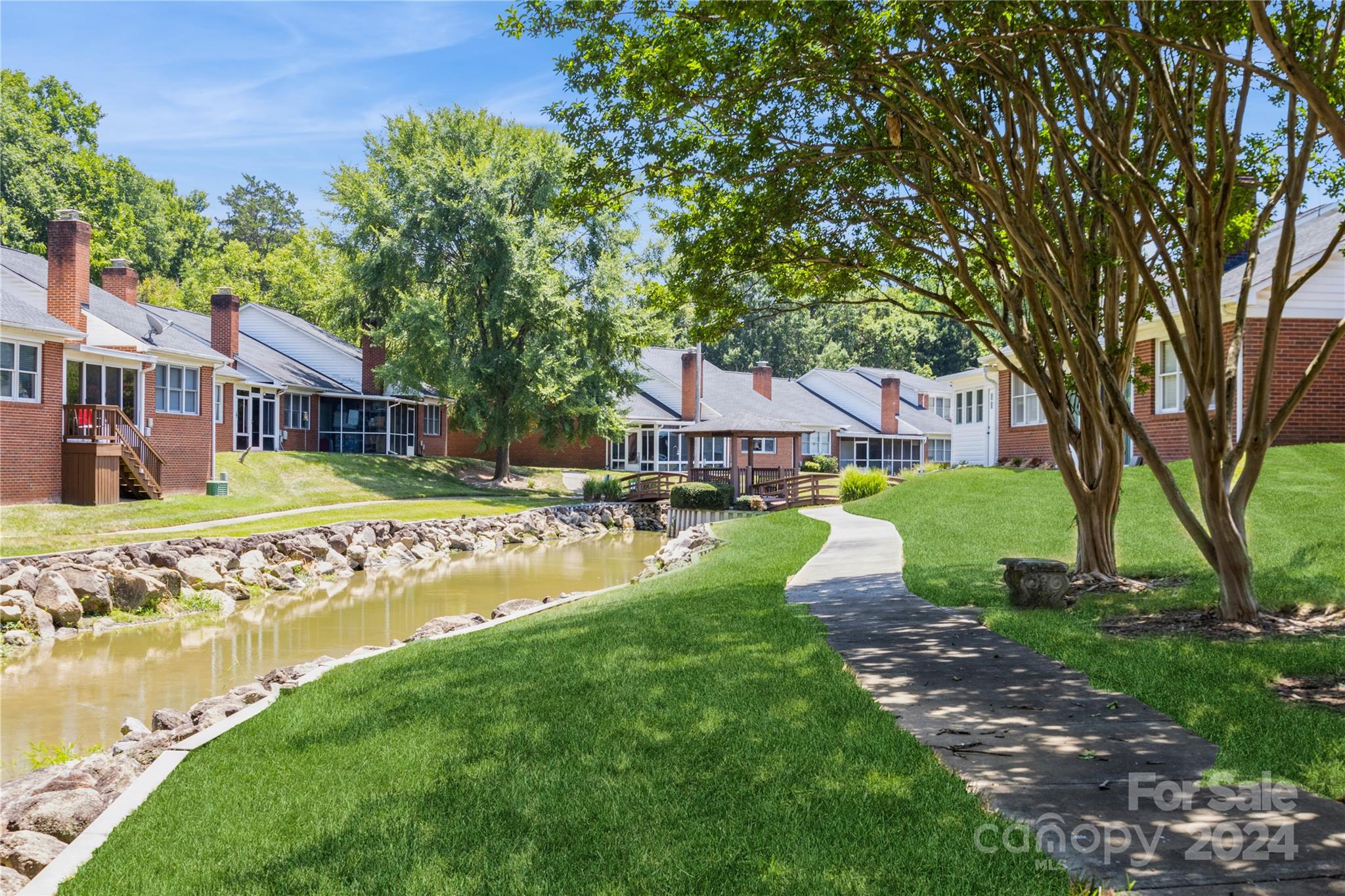 19960 Oak Leaf Circle Cornelius, NC 28031 - Photo 32 of 35 a front view of a house with garden