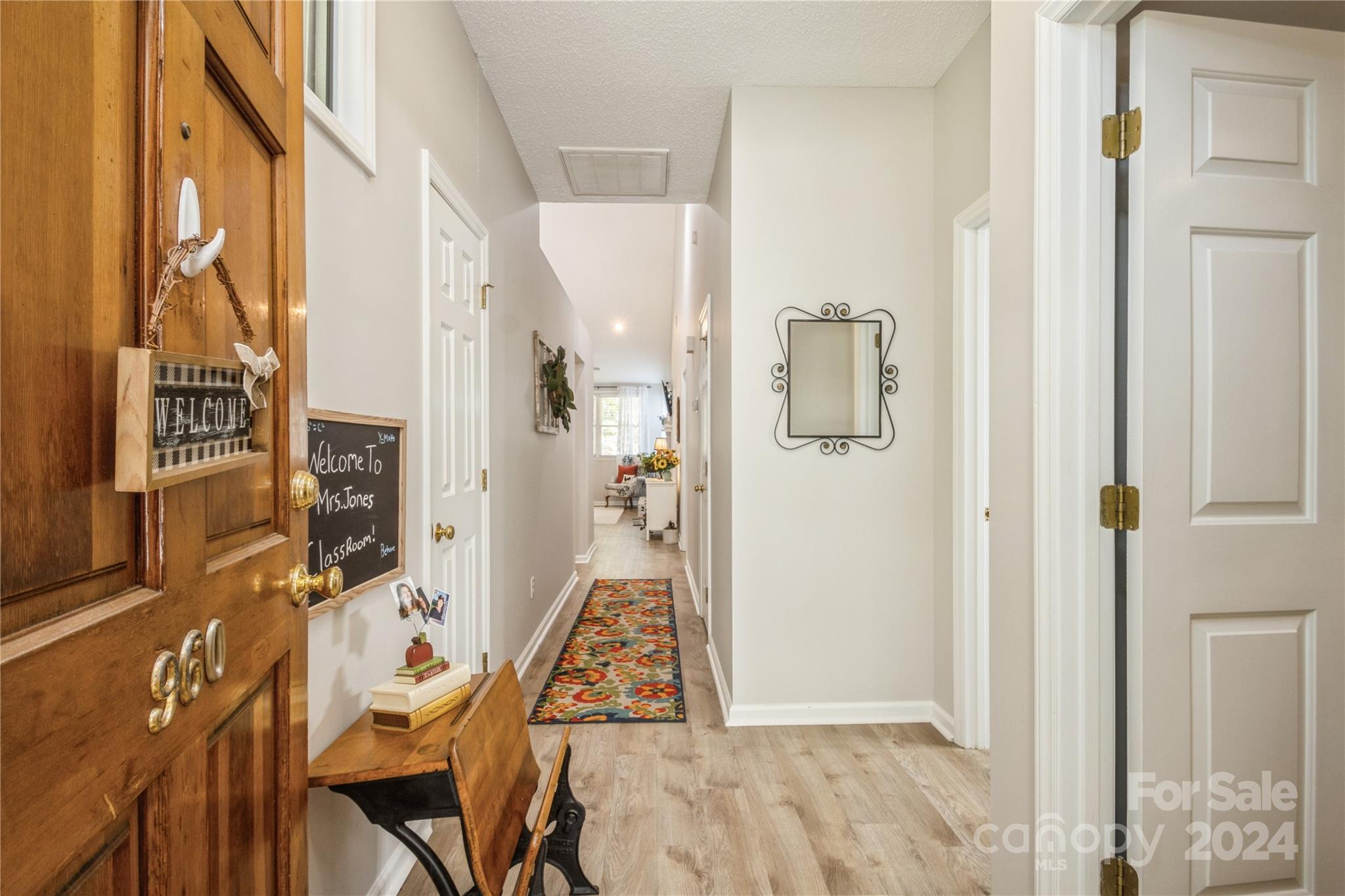 19960 Oak Leaf Circle Cornelius, NC 28031 - Photo 4 of 35 a view of an entryway with furniture and floor to ceiling window