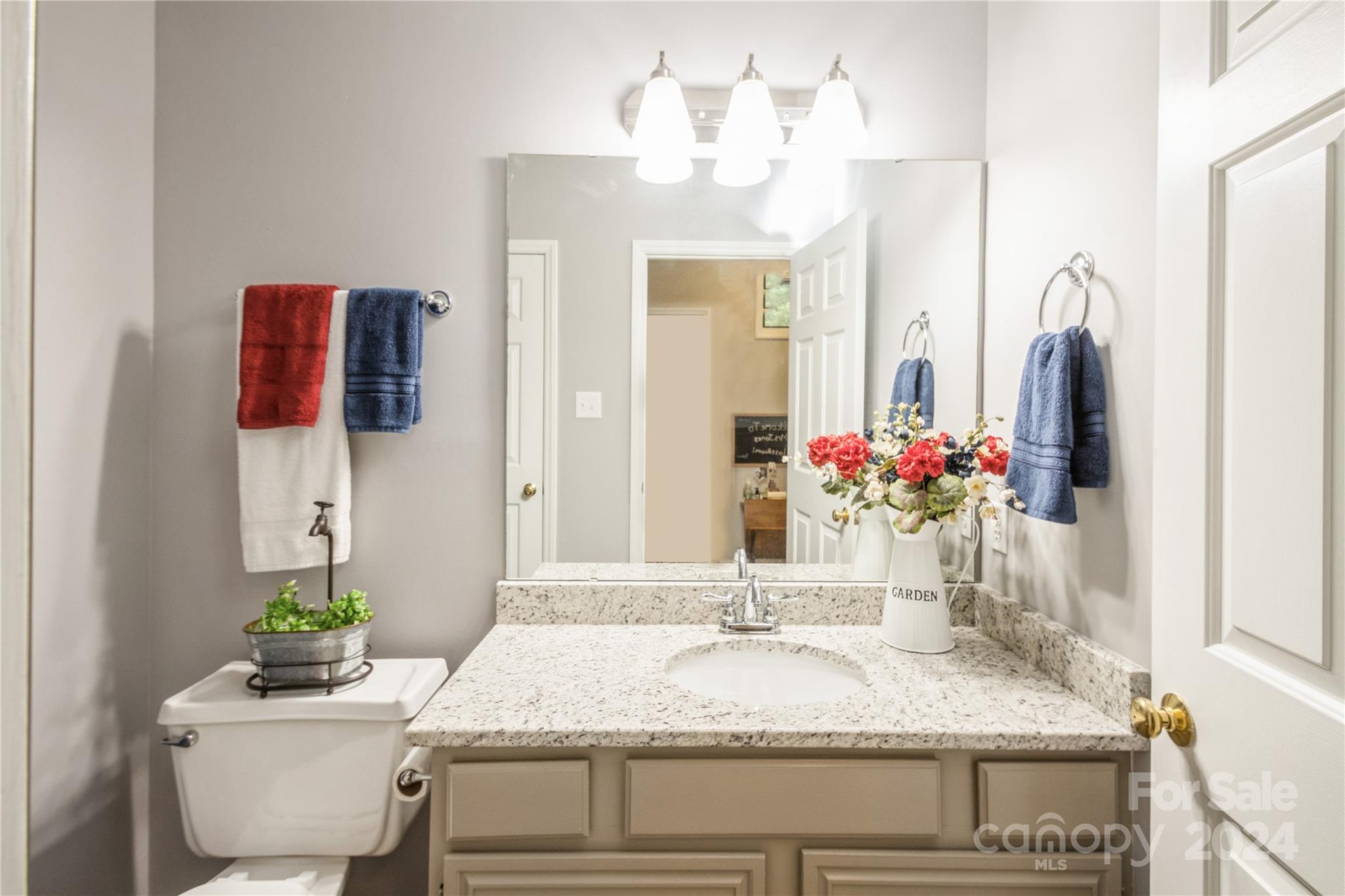 19960 Oak Leaf Circle Cornelius, NC 28031 - Photo 8 of 35 a bathroom with a granite countertop sink and a mirror