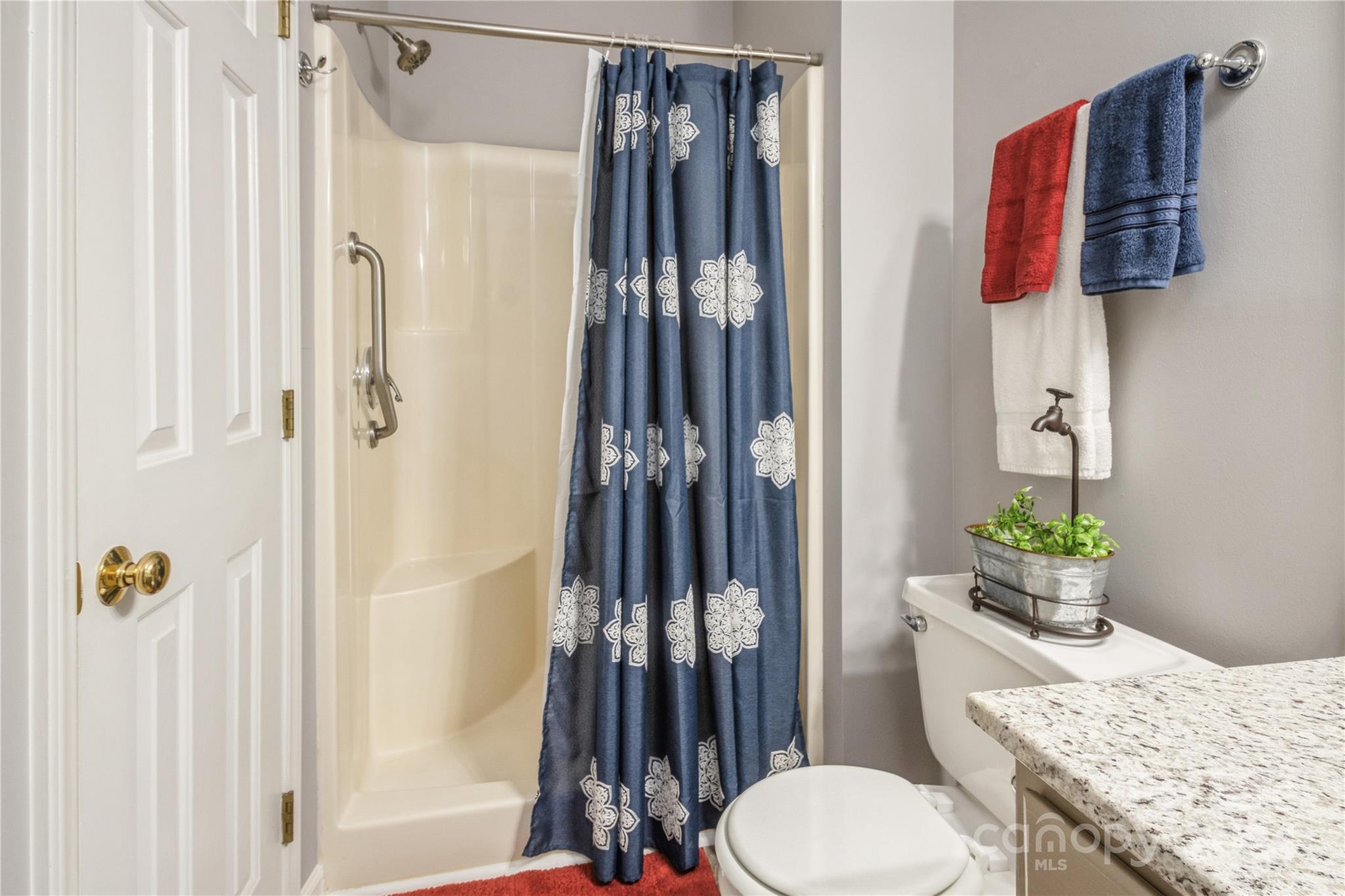 19960 Oak Leaf Circle Cornelius, NC 28031 - Photo 9 of 35 a bathroom with a granite countertop sink and a toilet