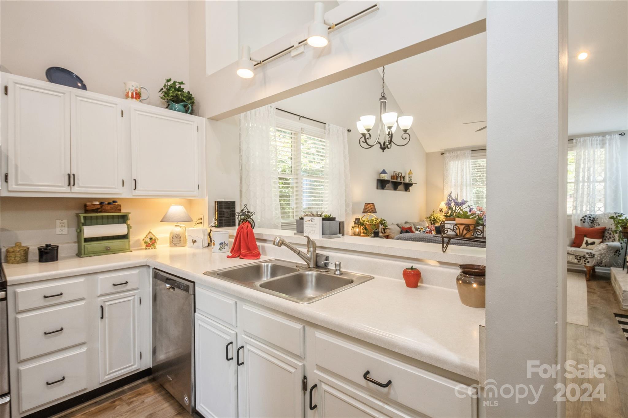 19960 Oak Leaf Circle Cornelius, NC 28031 - Photo 10 of 35 a kitchen with a sink and cabinets