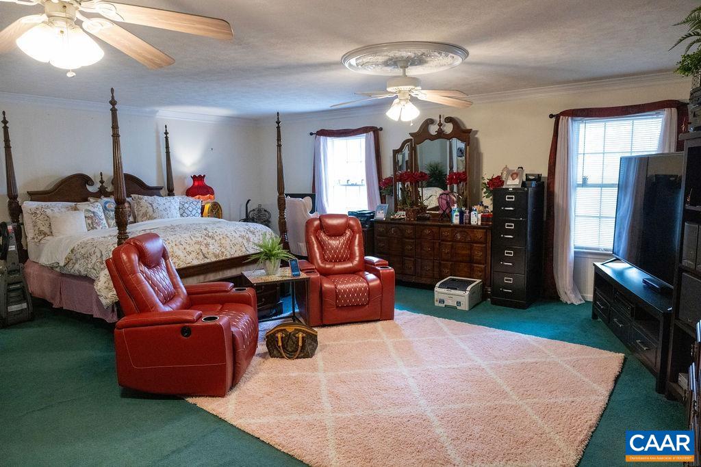 5705 Louisa Road Keswick, VA 22947 - Photo 11 of 19 a room with furniture and a flat screen tv