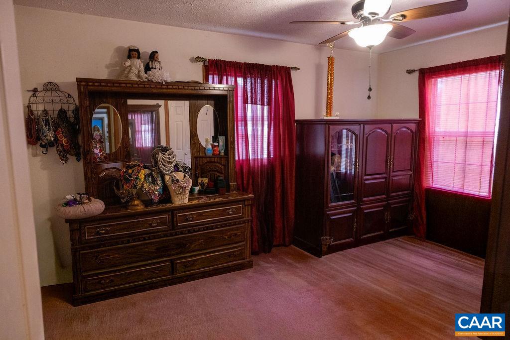 5705 Louisa Road Keswick, VA 22947 - Photo 12 of 19 a bed room with a bed and a dresser