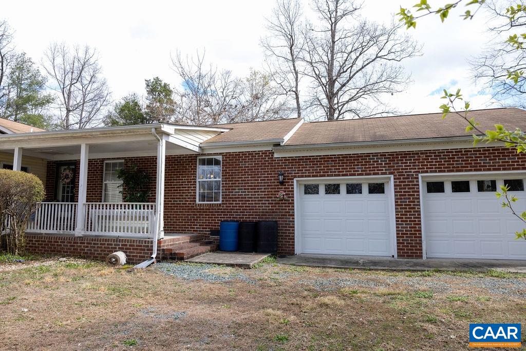 5705 Louisa Road Keswick, VA 22947 - Photo 2 of 19 a house that has a tree in front of it