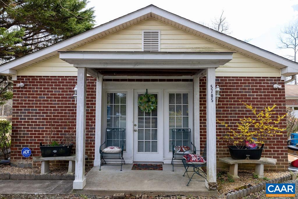 5705 Louisa Road Keswick, VA 22947 - Photo 3 of 19 a front view of a house with glass windows
