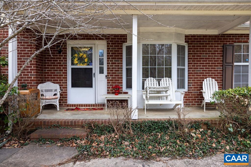5705 Louisa Road Keswick, VA 22947 - Photo 4 of 19 a view of a chair and table in the backyard