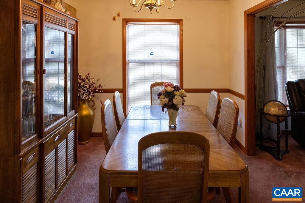 5705 Louisa Road Keswick, VA 22947 - Photo 7 of 19 a dining room with furniture and wooden floor