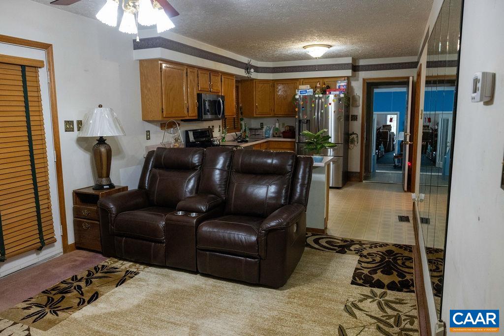 5705 Louisa Road Keswick, VA 22947 - Photo 8 of 19 a living room with furniture and a flat screen tv