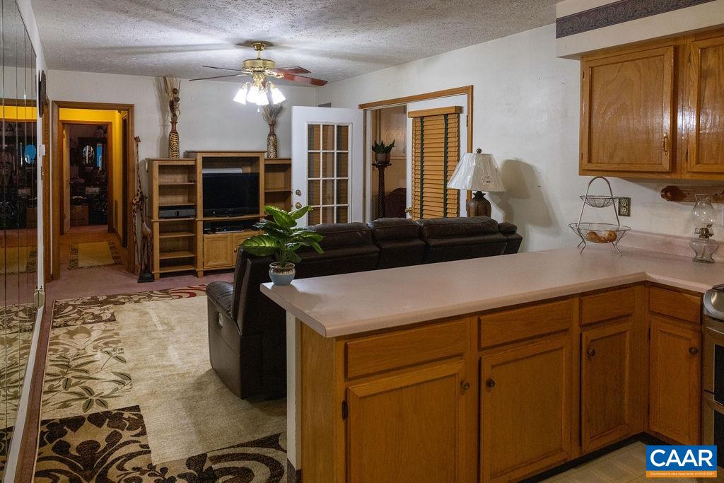 5705 Louisa Road Keswick, VA 22947 - Photo 9 of 19 a kitchen with a refrigerator and a sink