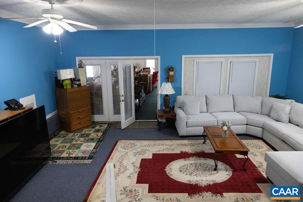 5705 Louisa Road Keswick, VA 22947 - Photo 10 of 19 a living room with furniture and a rug