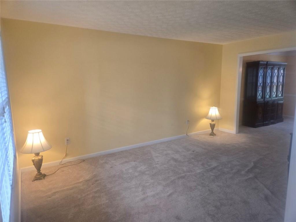 22 Windcrest Keep Covington, GA 30016 - Photo 8 of 32 a view of empty room with lamp