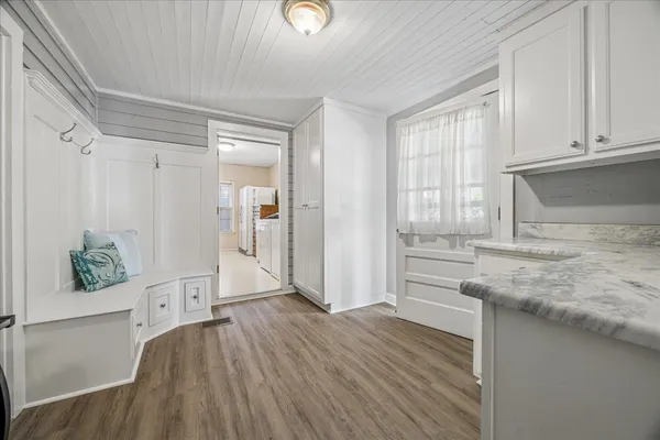 wooden floor in an empty room and a window