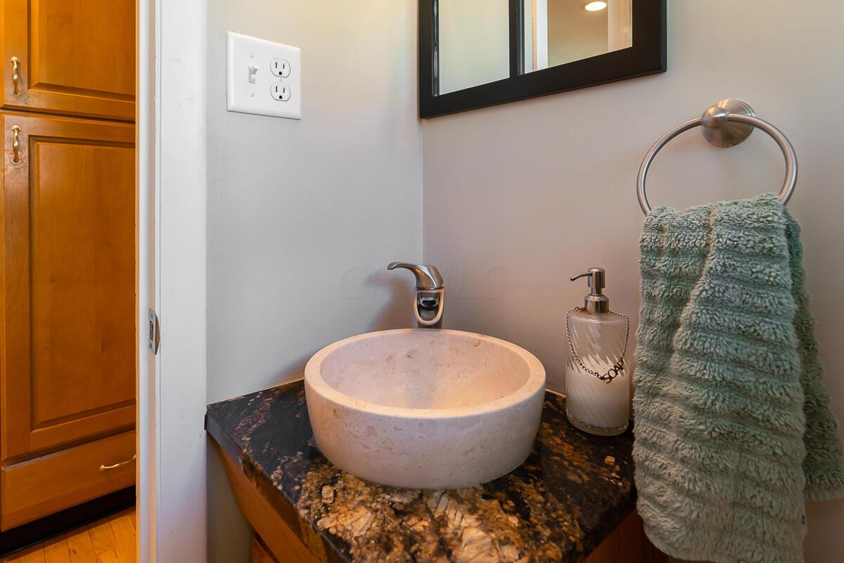5905 Litchfield Road Columbus, OH 43235 - Photo 14 of 39 Half bath off the kitchen, near the garage