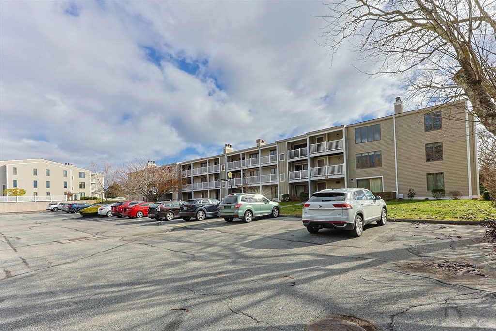 42 Old Colony Way, Unit 28 Orleans, MA 02653 - Photo 23 of 35 a car parked in front of a building