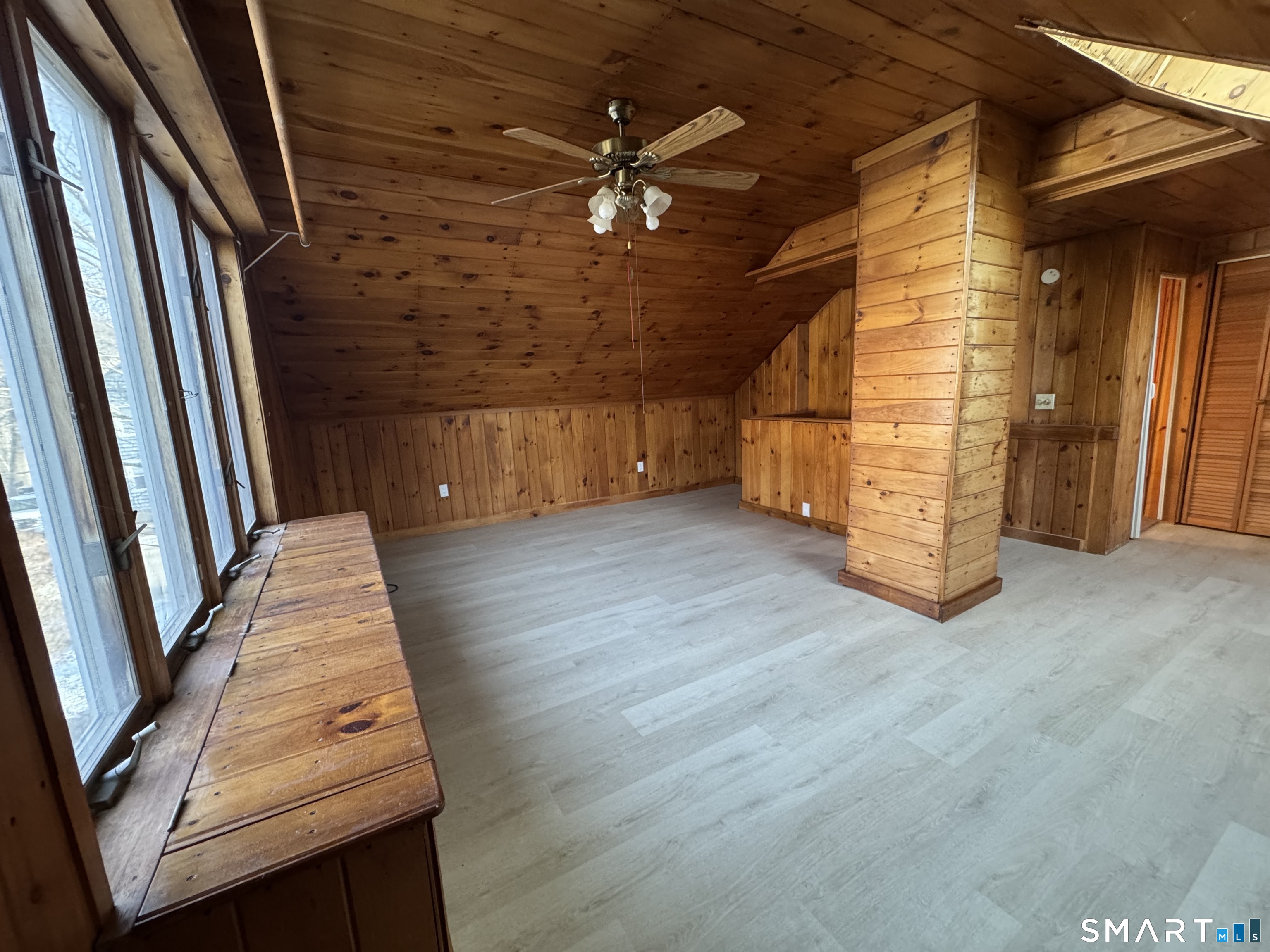23 High Street Plainfield, CT 06354 - Photo 17 of 22 a view of a livingroom with wooden floor and a ceiling fan