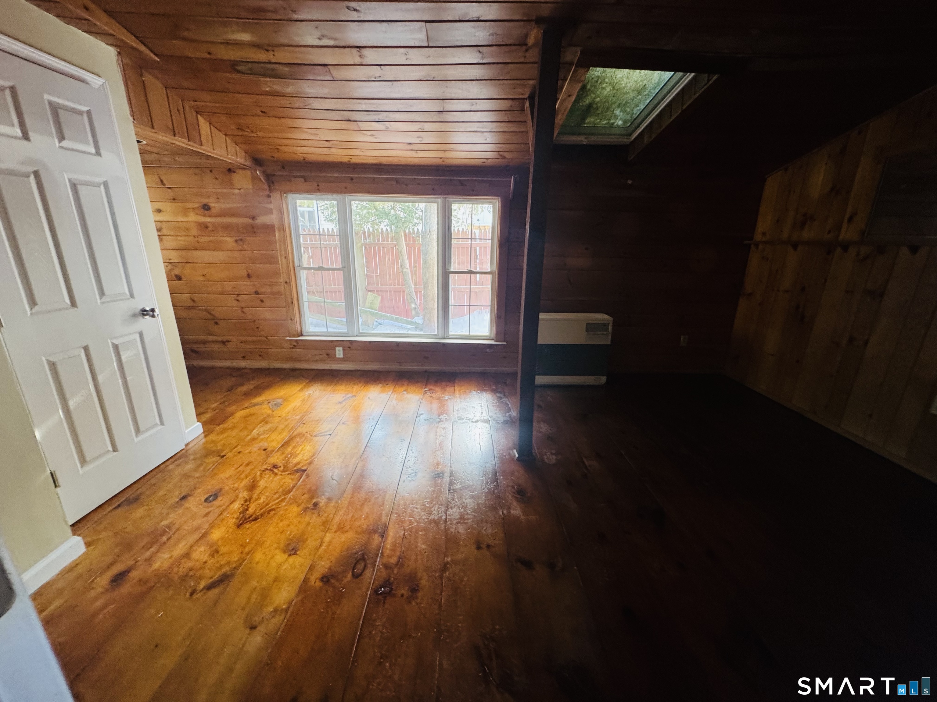 23 High Street Plainfield, CT 06354 - Photo 7 of 22 a view of empty room with wooden floor and fan