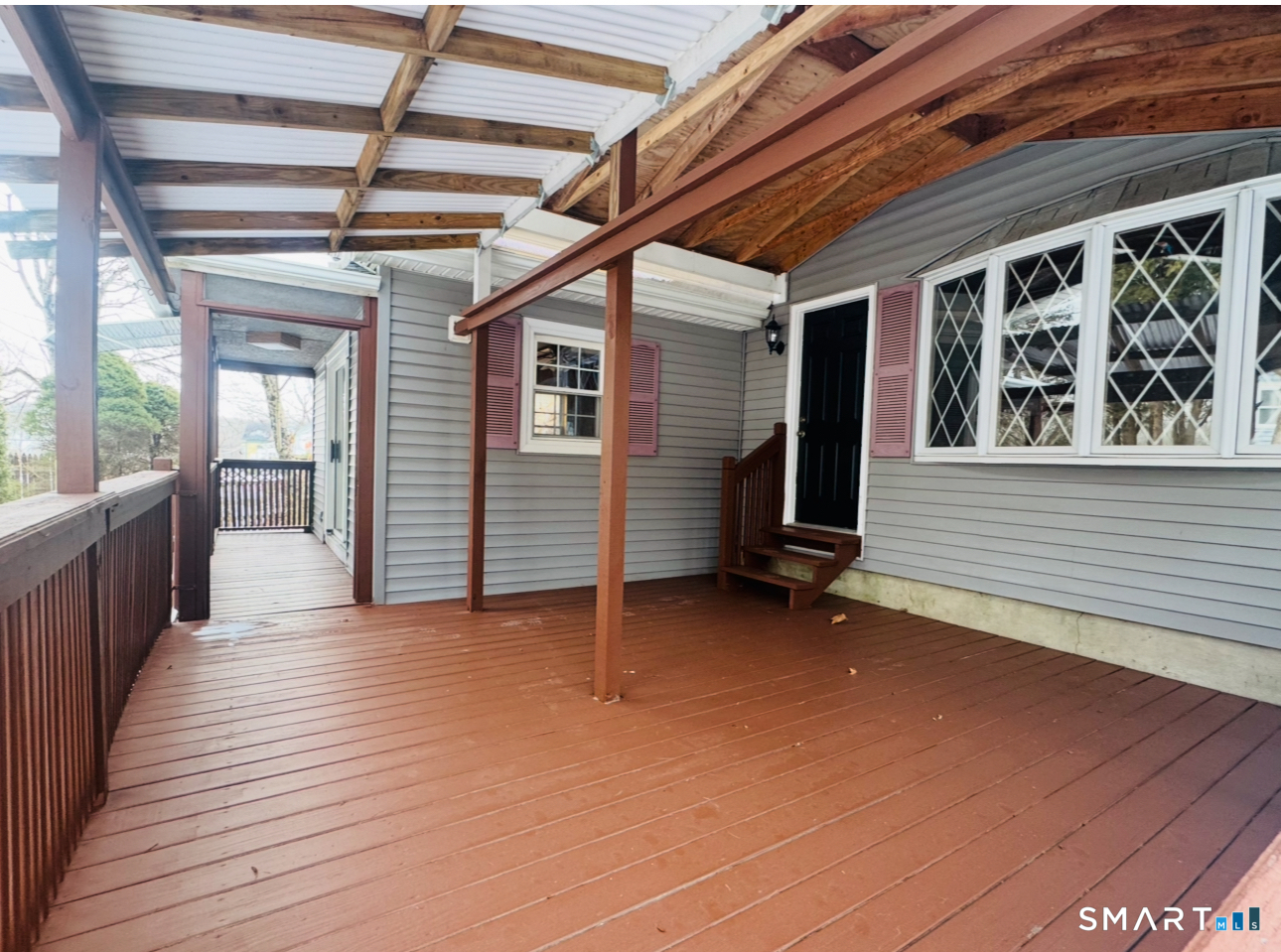 23 High Street Plainfield, CT 06354 - Photo 8 of 22 a view of a porch with wooden floor and stairs