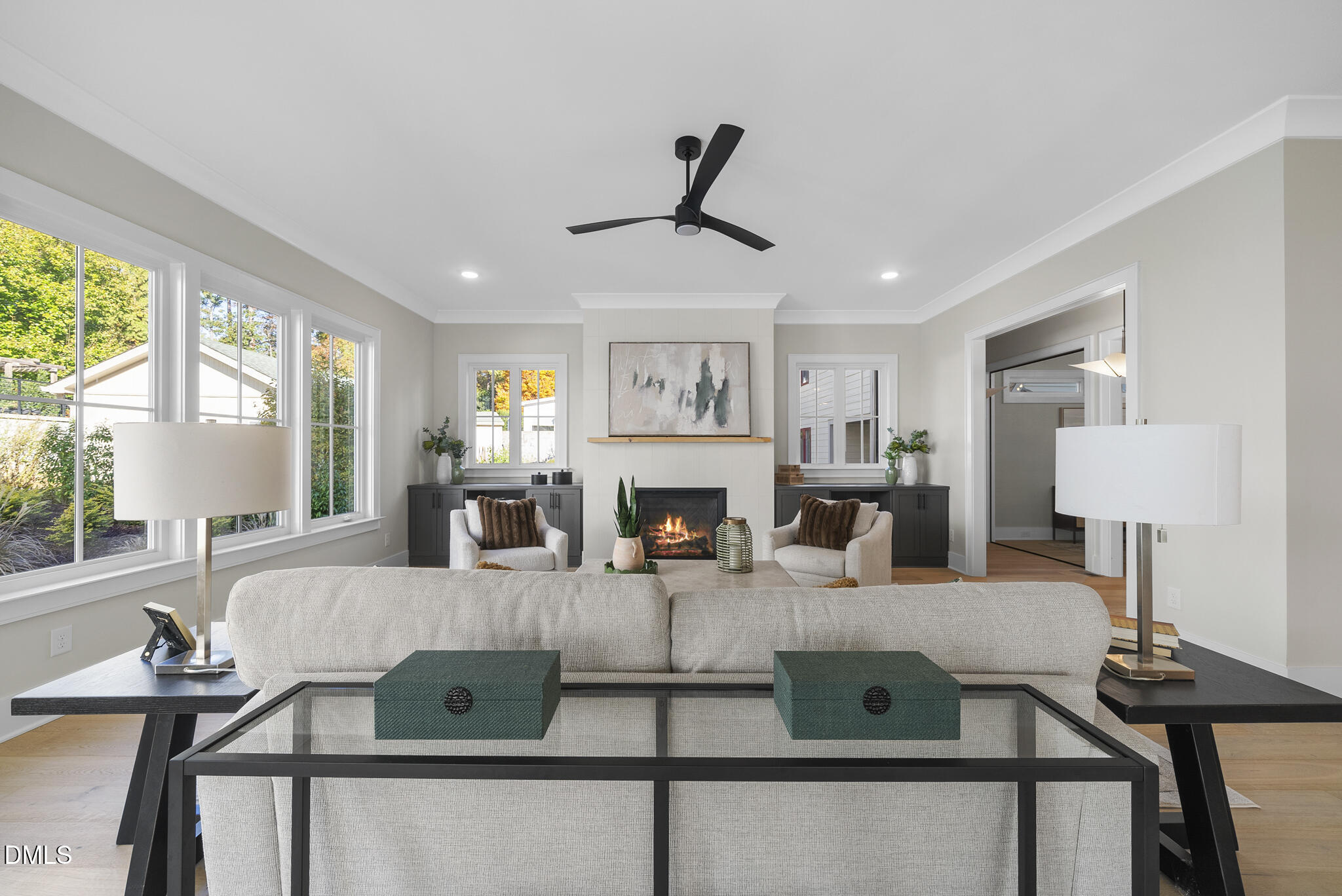 1003 Canterbury Road Raleigh, NC 27607 - Photo 12 of 45 a living room with furniture a fireplace and a large window