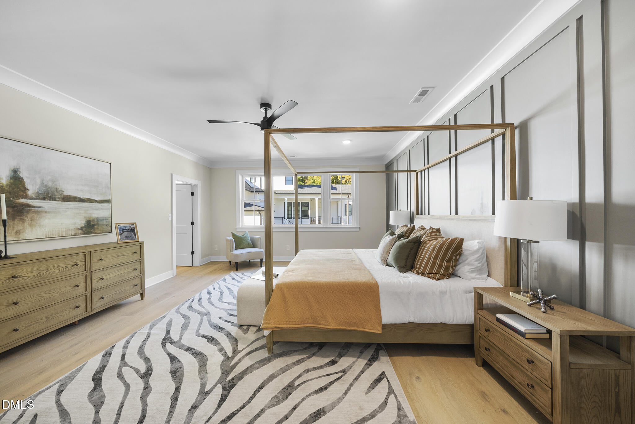 1003 Canterbury Road Raleigh, NC 27607 - Photo 17 of 45 a bedroom with a bed and wooden floor