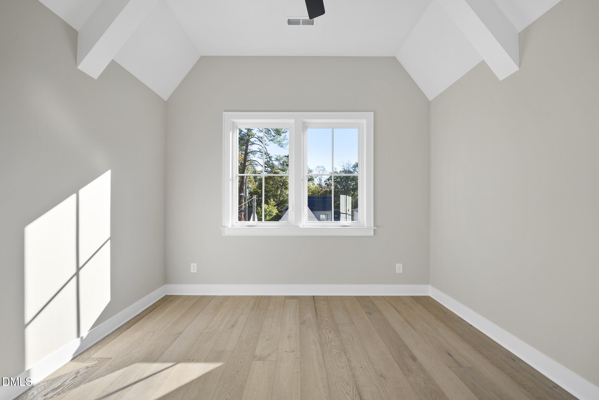 1003 Canterbury Road Raleigh, NC 27607 - Photo 27 of 45 an empty room with wooden floor and windows