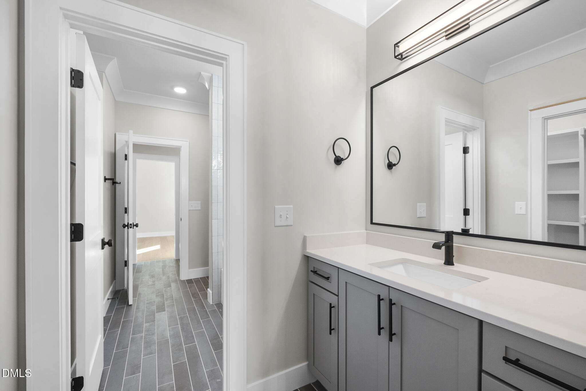 1003 Canterbury Road Raleigh, NC 27607 - Photo 32 of 45 a bathroom with a sink and a mirror