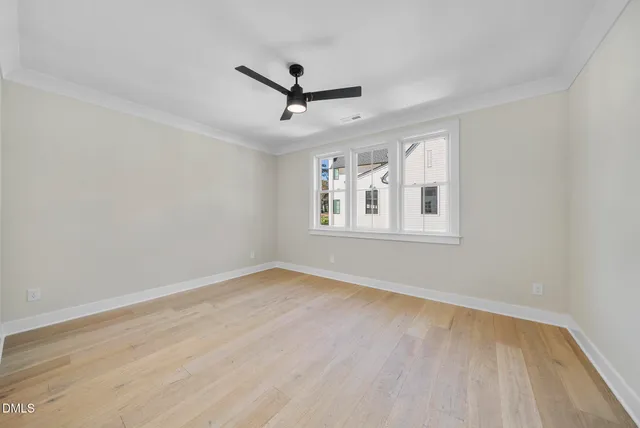 a view of an empty room with a fireplace