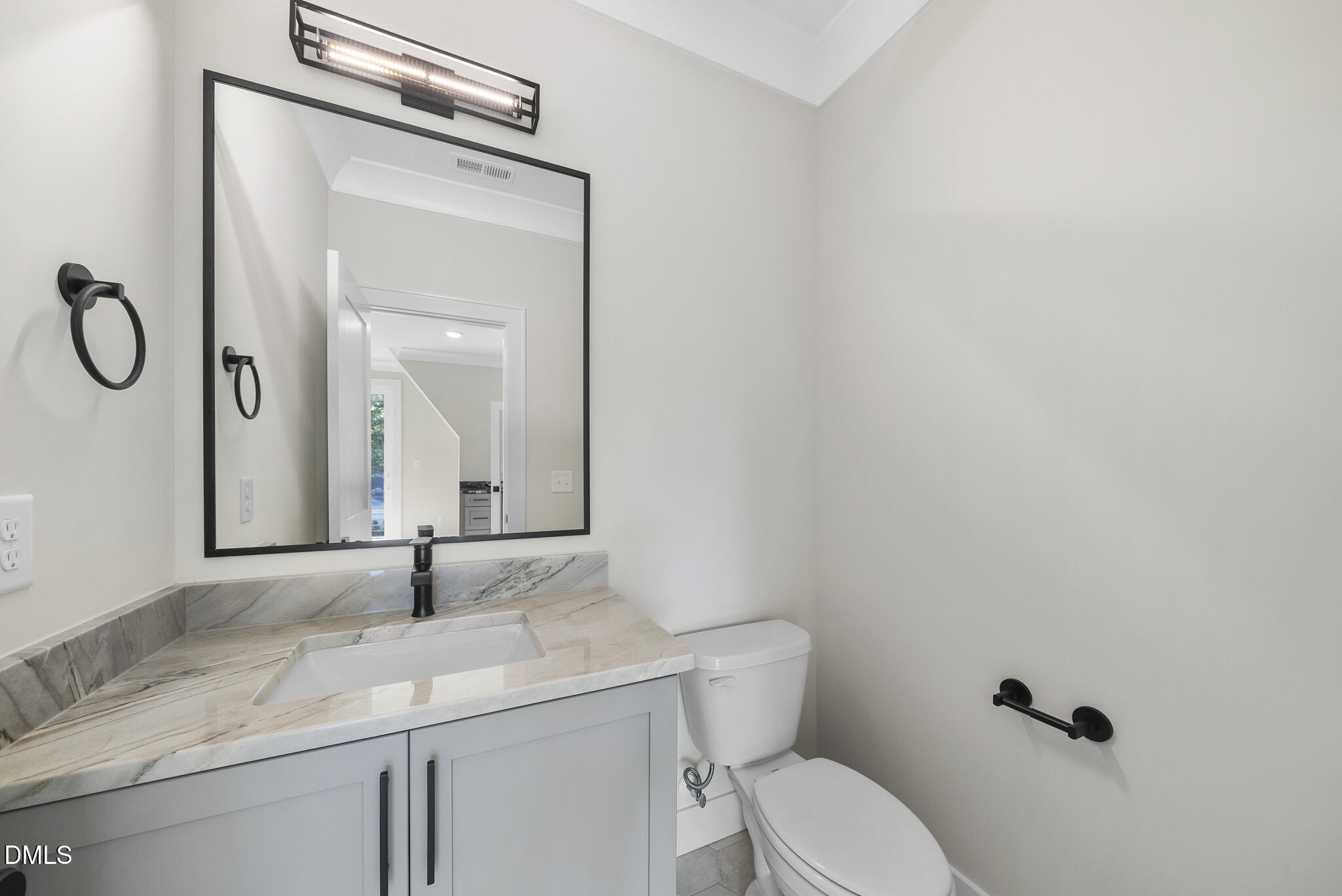 1003 Canterbury Road Raleigh, NC 27607 - Photo 38 of 45 a bathroom with a granite countertop sink toilet and mirror