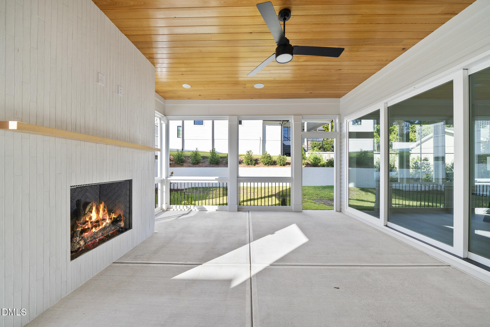 1003 Canterbury Road Raleigh, NC 27607 - Photo 42 of 45 a view of an empty room with a fireplace and a window